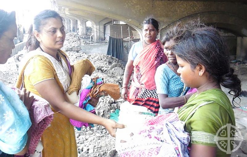 Slum Dwellers Receive Clothes on Gandhi Jayanthi